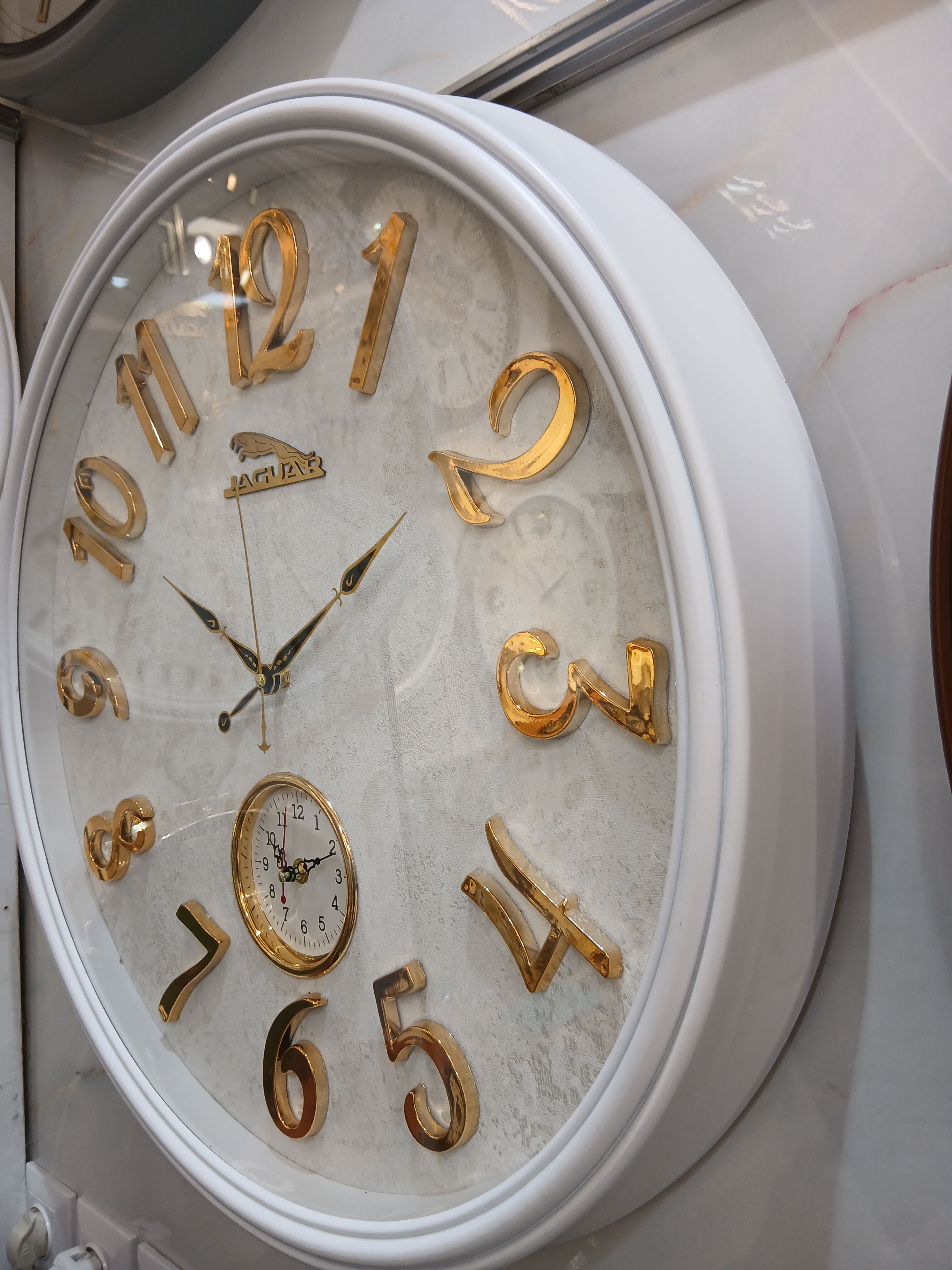 ساعت دیواری دوموتوره آرام گرد جگوار